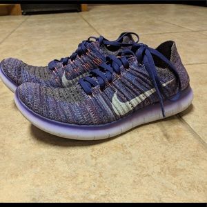New purple Nike knit shoes.